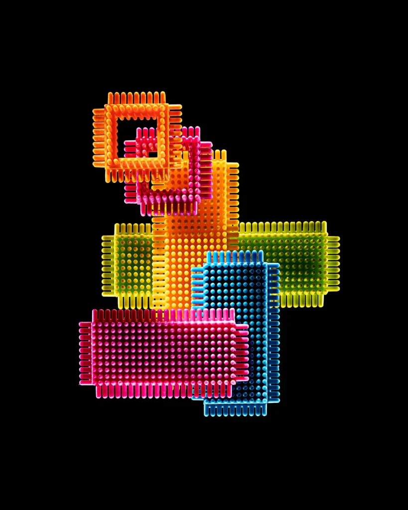 Interlocking blocks of coloured plastic bristles on black