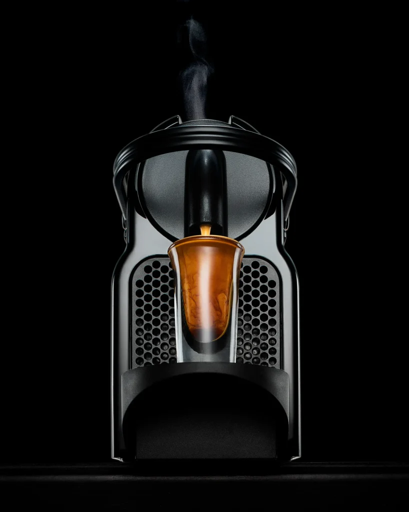 Espresso machine pouring against a black background