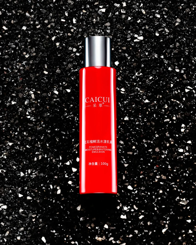 Red cosmetic bottle on black and white terrazzo