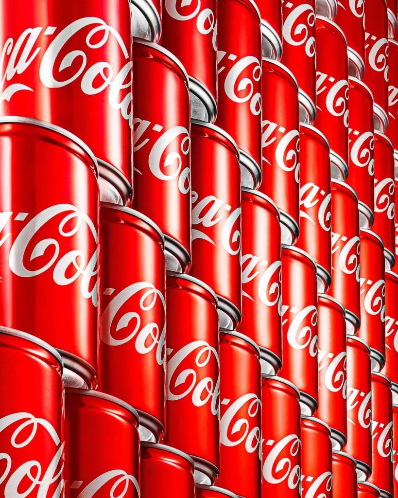 Rows of red cans arranged in a steep diagonal grid