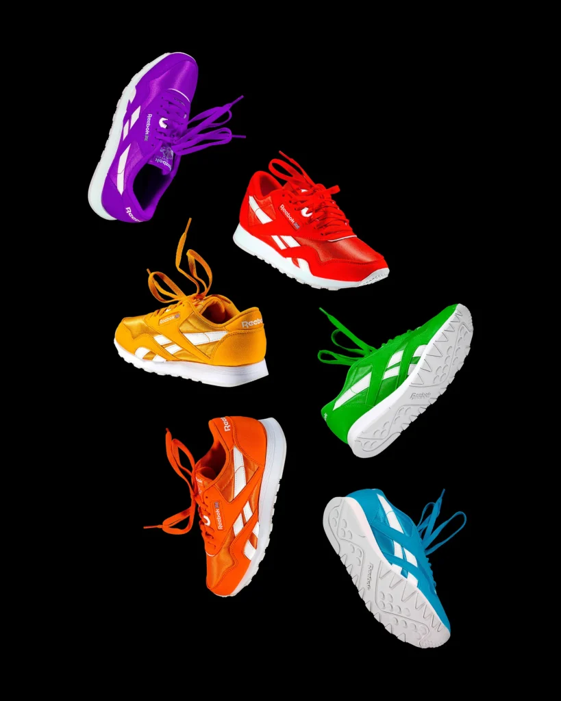 Six trainers in bright colours arranged in a loose ring