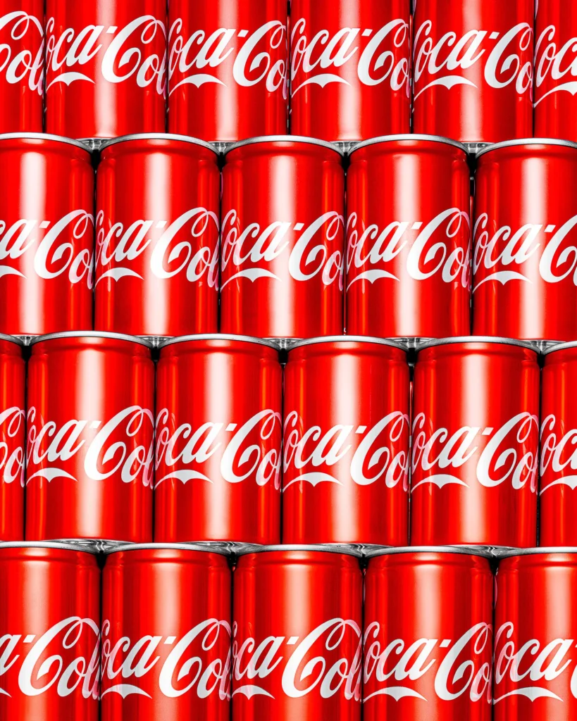 Wall of red cans stacked in even rows